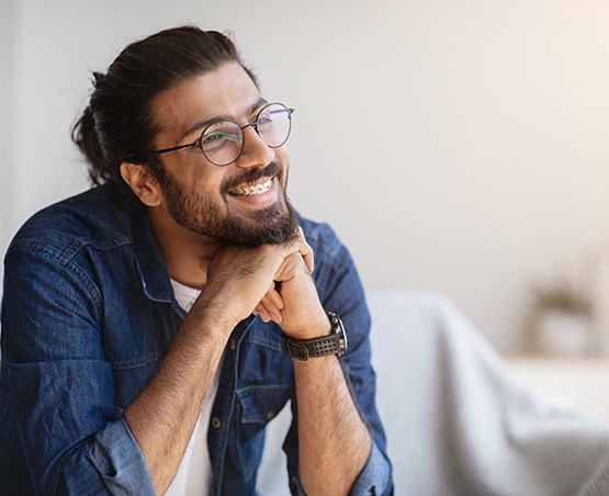 Adult male wearing traditional braces