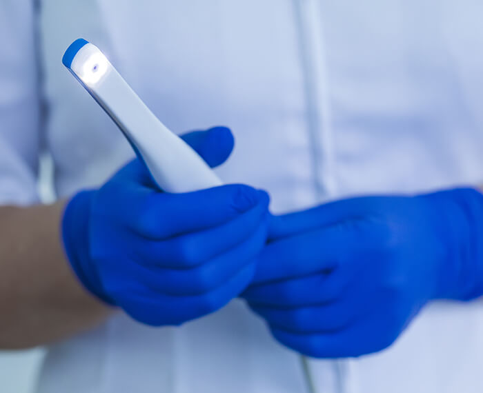 Dentist holding an intraoral camera