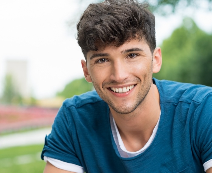 Teen smiling after dental checkup and teeth cleaning