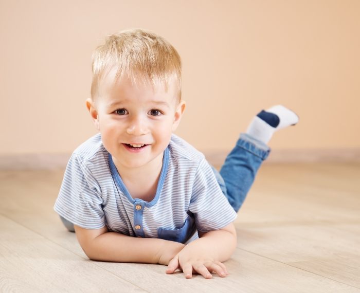 Child smiling after dental checkup and teeth cleaning for toddlers