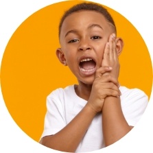 Child holding their face in pain