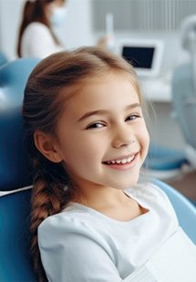 a child patient smiling during a dental visit near Blackhawk