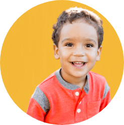 Young child smiling after dentistry for toddlers