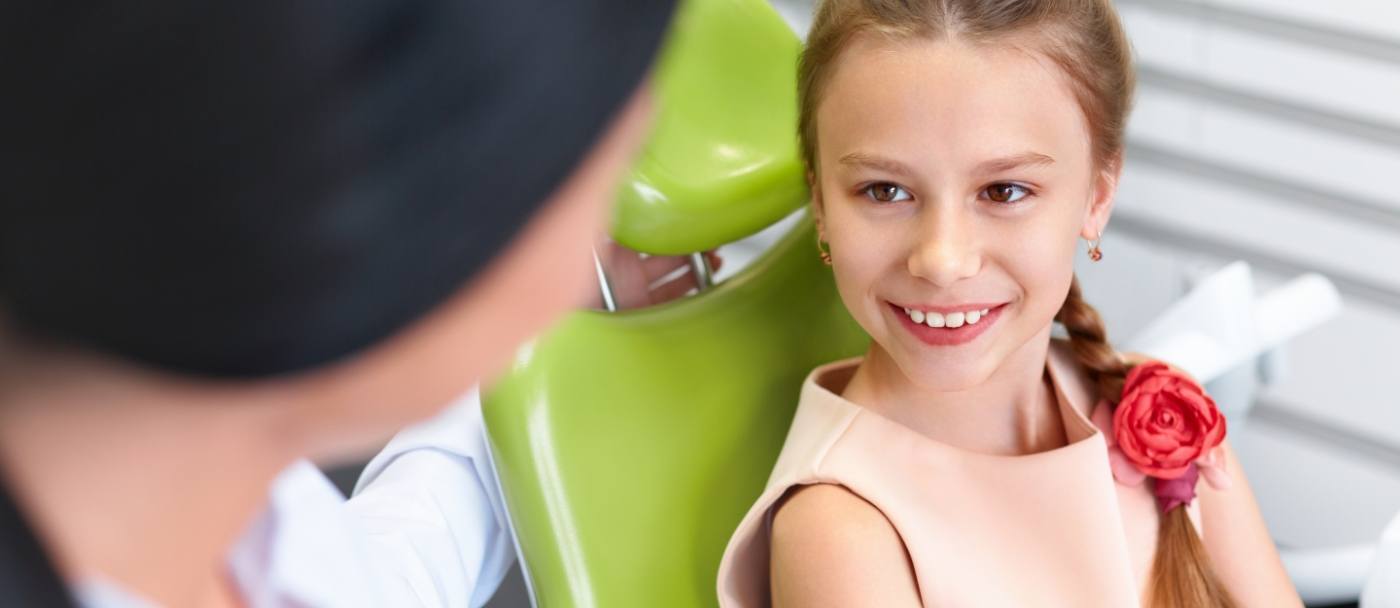 Child smiling during pediatric emergency dentistry visit