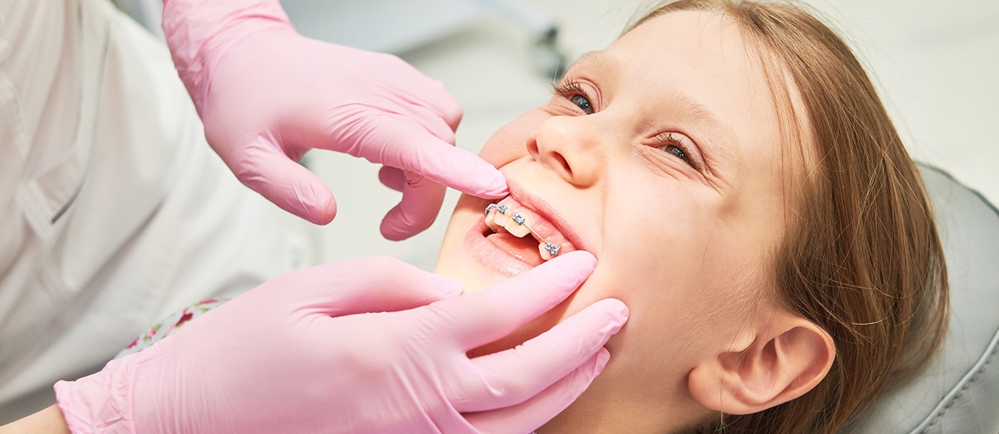 a child getting braces at the orthodontist’s office