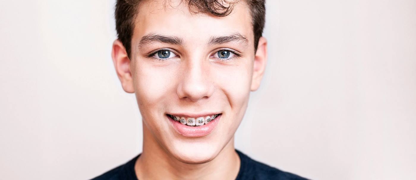 Portrait of teenage boy with braces