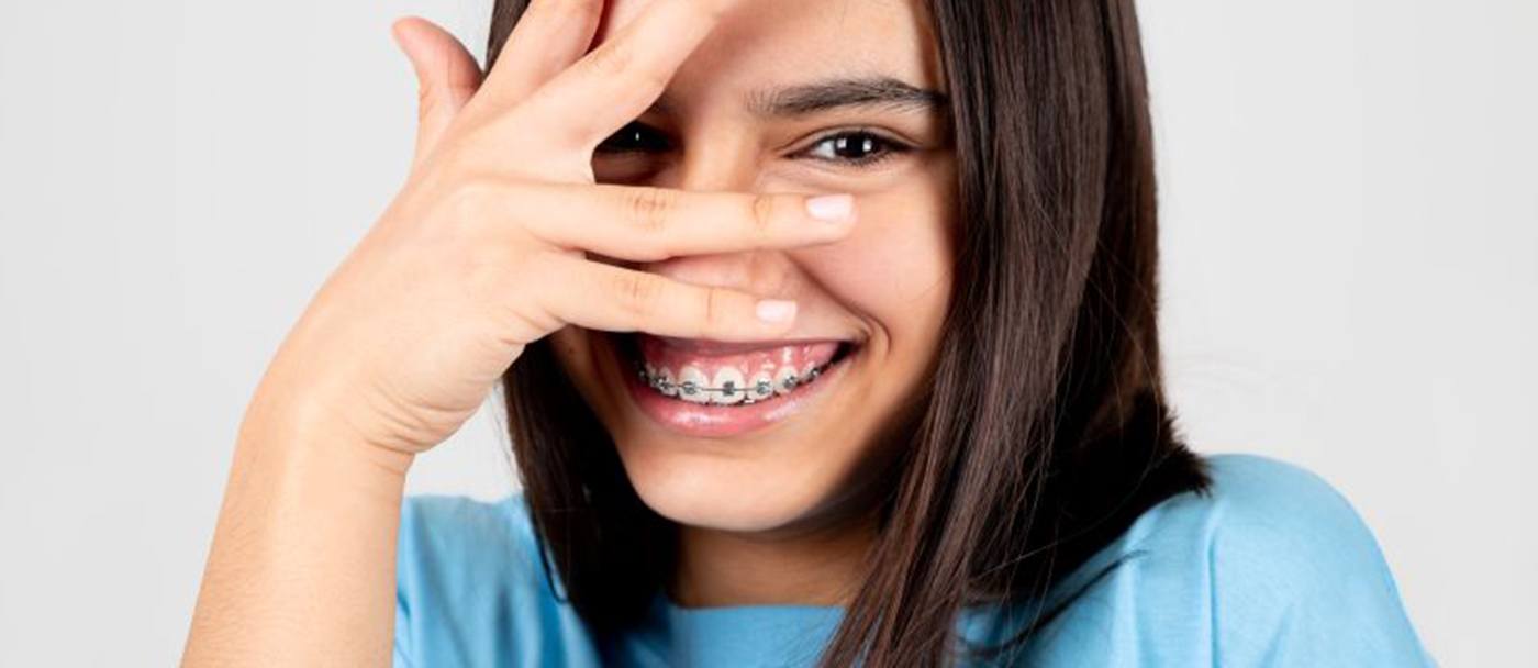 Smiling teen girl with braces