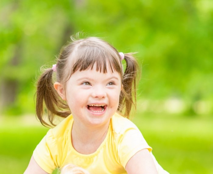 Child smiling after special needs dentistry visit