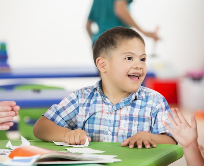 Child laughing before special need dentistry visit