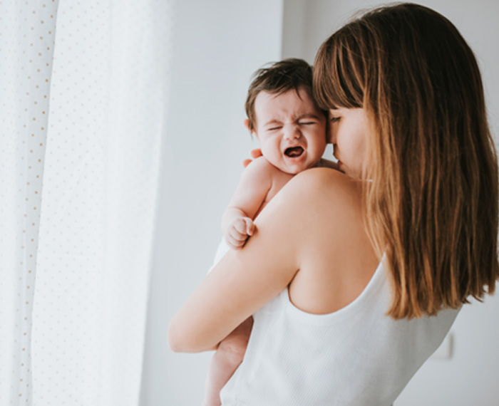 Mother trying to comfort a fussy baby