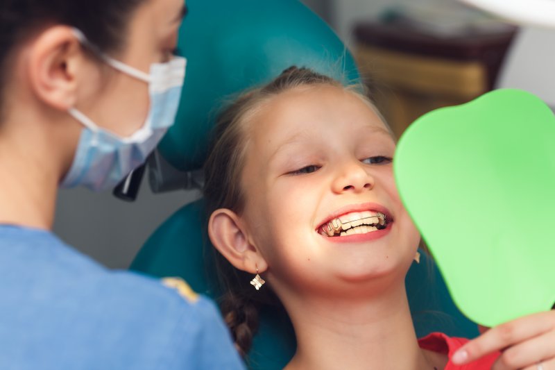 Child smiling with braces