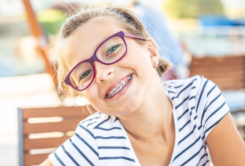 Girl with braces, smiling